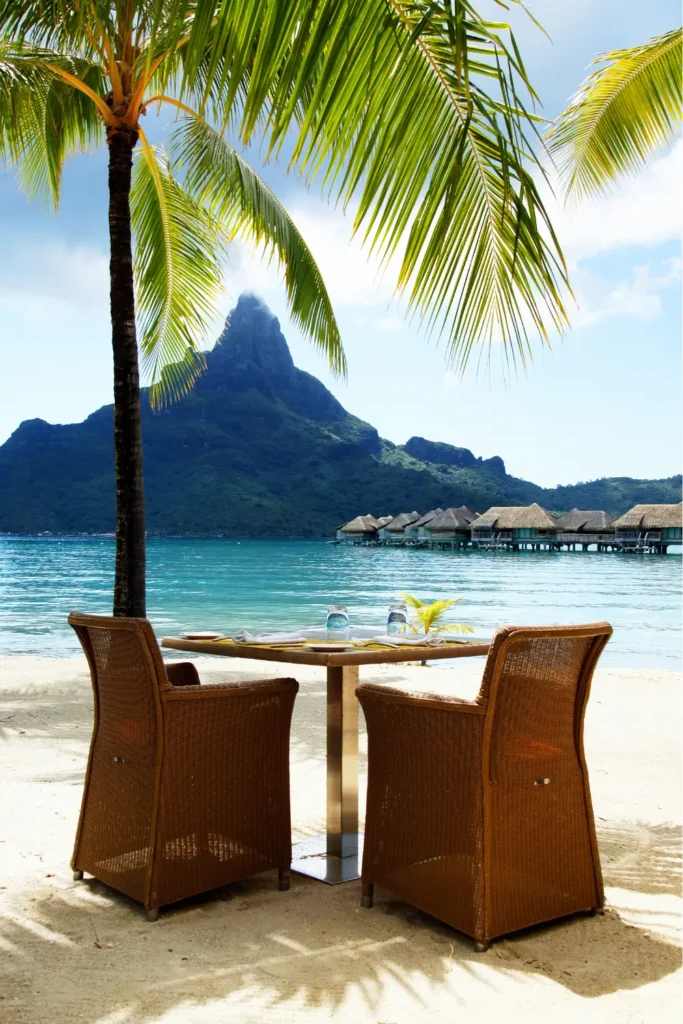 Pinterest pin: 10 Dream Vacation Destinations You Need to See to Believe - featuring Bora Bora’s turquoise beach as a top dream holiday destination.
