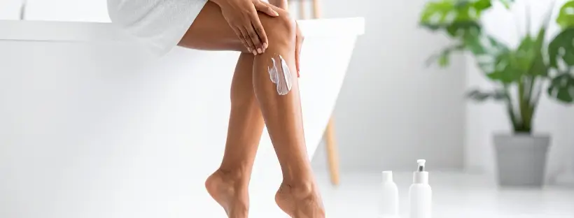 Woman applying clean, fragrance-free body lotion—supporting skin hydration without hormone disruptors.