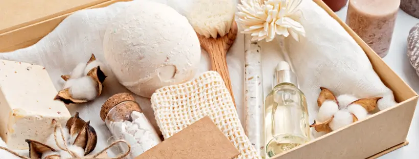 Zero-waste skincare set with glass bottle, natural soap, cotton buds, and refillable beauty packaging on linen.