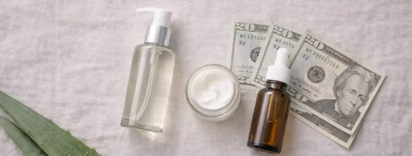 Affordable clean skincare routine under $60 featuring glass-bottled products on a minimalist bathroom shelf with natural light and eco-friendly aesthetic.